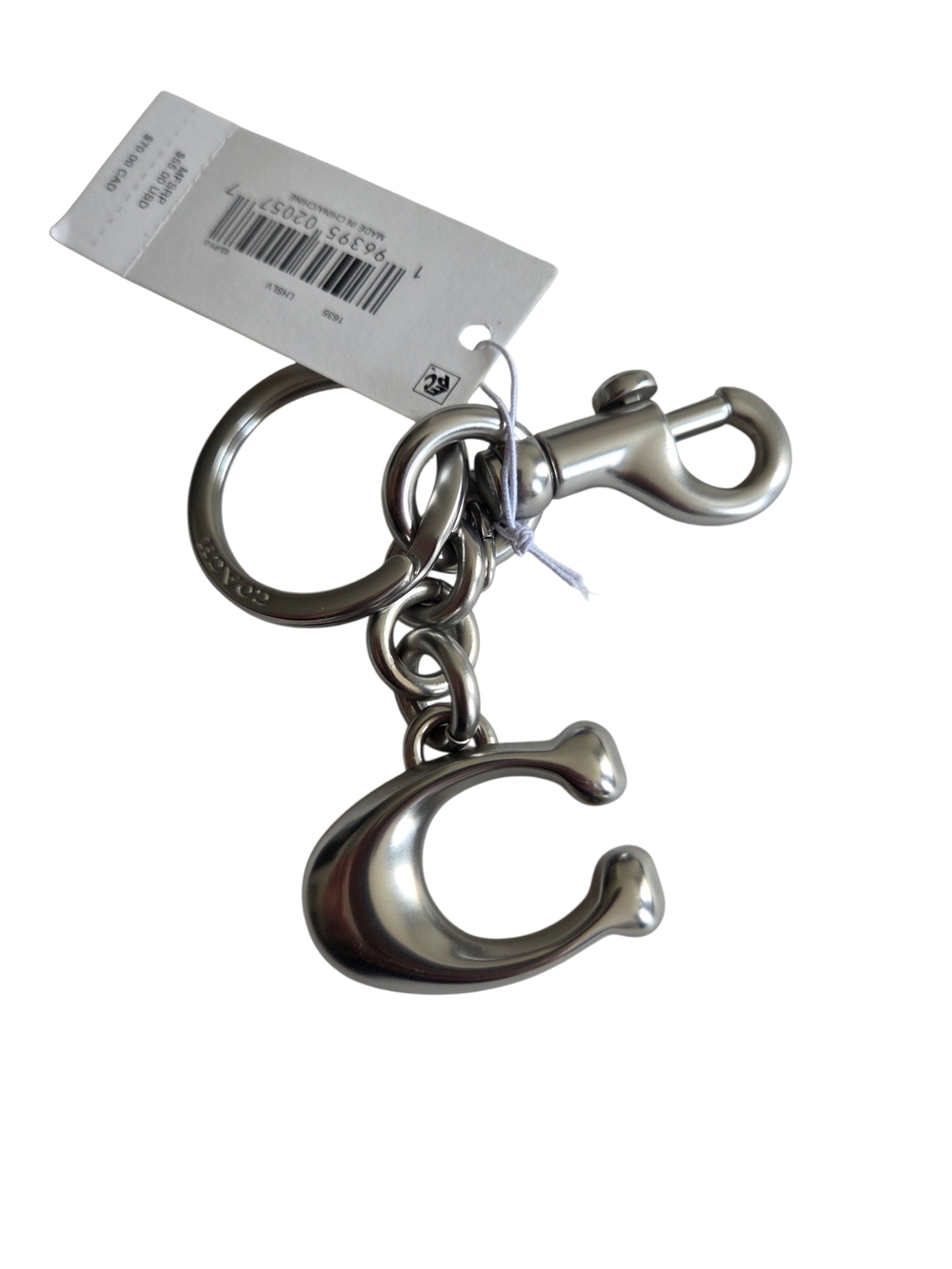 Coach Silver Keychain with a Pendant in Logo Shape